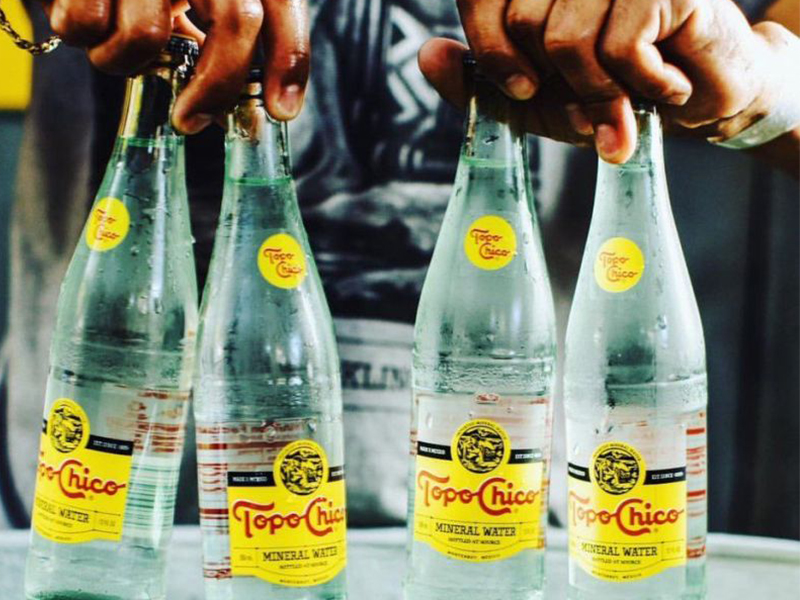 Arca Continental cede derechos de Topo Chico a Coca-Cola